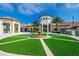Elegant clubhouse with fountain and manicured lawn on a sunny day at 1173 Trappers Trail Loop, Champions Gate, FL 33896