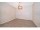 Dining room features elegant wood-look tile flooring and modern light fixture at 1173 Trappers Trail Loop, Champions Gate, FL 33896