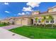 Well-maintained home with a two-car garage, tile roof, and lush green lawn at 1173 Trappers Trail Loop, Champions Gate, FL 33896