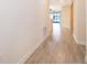 Inviting hallway with tile flooring, neutral walls, and ample natural light at 1173 Trappers Trail Loop, Champions Gate, FL 33896