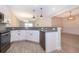 Spacious kitchen with stainless steel appliances, open floor plan, and modern cabinetry at 1173 Trappers Trail Loop, Champions Gate, FL 33896