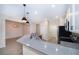 Stylish kitchen with stainless steel appliances, modern countertops, and adjacent dining area at 1173 Trappers Trail Loop, Champions Gate, FL 33896