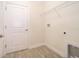 Bright laundry room with tile floors, shelving, and utility connections at 1173 Trappers Trail Loop, Champions Gate, FL 33896