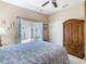 Cozy bedroom with access to a screened patio and a spacious closet at 125 Prima Dr, Poinciana, FL 34759