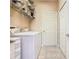 Practical laundry area with modern washer and dryer, white cabinetry and convenient access to storage at 125 Prima Dr, Poinciana, FL 34759
