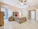 Spacious primary bedroom with tile floors, and multiple doorways at 125 Prima Dr, Poinciana, FL 34759