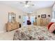 Large main bedroom featuring a ceiling fan, and decorative furniture at 125 Prima Dr, Poinciana, FL 34759