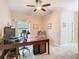 Well-lit office with tile flooring, desk, and comfortable chair at 125 Prima Dr, Poinciana, FL 34759