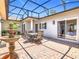 A stunning patio with brick flooring, dining set and fountain for relaxation and entertaining in style at 125 Prima Dr, Poinciana, FL 34759