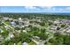 Scenic aerial shot of a small town with the ocean in the distance, highlighting residential and commercial areas at 1322 New York Ave, St Cloud, FL 34769