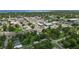 A wide shot of the downtown area and surrounding neighborhoods near the ocean with tree coverage at 1322 New York Ave, St Cloud, FL 34769