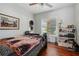 Bedroom featuring wood floors, natural light and an inviting bed at 1322 New York Ave, St Cloud, FL 34769