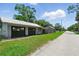 Detached two-car garage with plenty of space for parking and storage, set in a lush green yard at 1322 New York Ave, St Cloud, FL 34769