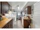 Kitchen featuring wood-grain cabinets and countertops and white appliances at 1322 New York Ave, St Cloud, FL 34769