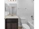 This bathroom offers a tub and shower combination, a single sink vanity and neutral paint tones at 1416 Oak Marsh St, Davenport, FL 33837