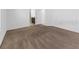 An empty bedroom is carpeted and has white walls and a white door at 1416 Oak Marsh St, Davenport, FL 33837