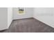 Clean bedroom with neutral carpet and window at 1416 Oak Marsh St, Davenport, FL 33837