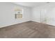 A simple empty bedroom has carpet and a window that lets in light at 1416 Oak Marsh St, Davenport, FL 33837