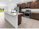 Spacious kitchen featuring stainless appliances and center island at 1416 Oak Marsh St, Davenport, FL 33837