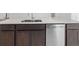 Kitchen island with stainless steel dishwasher and sink at 1416 Oak Marsh St, Davenport, FL 33837
