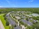 Aerial view of community with a lake and lush trees at 14234 Desert Haven St # 14234, Windermere, FL 34786