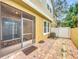 Backyard patio and screened in patio with view of AC and white fence at 14234 Desert Haven St # 14234, Windermere, FL 34786