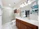 Bright bathroom featuring double sinks, a walk-in shower, and ample counter space at 14234 Desert Haven St # 14234, Windermere, FL 34786