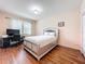 Inviting bedroom features wood floors, a computer desk, and a bright window at 14234 Desert Haven St # 14234, Windermere, FL 34786