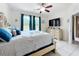 Bright bedroom featuring a ceiling fan, a dresser, and sliding doors to a balcony with natural light at 14234 Desert Haven St # 14234, Windermere, FL 34786