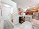 Inviting entryway with tile flooring leading to a modern kitchen and staircase at 14234 Desert Haven St # 14234, Windermere, FL 34786