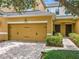 Charming townhome featuring a two-car garage, brick-paved driveway, and double front doors at 14234 Desert Haven St # 14234, Windermere, FL 34786