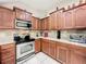 Updated kitchen with stainless steel appliances, granite counters and tile backsplash at 14234 Desert Haven St # 14234, Windermere, FL 34786