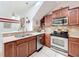 Stylish kitchen with stainless steel appliances, granite countertops, and ample cabinet space at 14234 Desert Haven St # 14234, Windermere, FL 34786