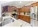 Well-lit kitchen featuring stainless steel appliances, ample cabinetry, and granite countertops at 14234 Desert Haven St # 14234, Windermere, FL 34786