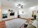 Open living room with wood floors, ceiling fan, and access to multiple rooms, perfect for entertaining at 14234 Desert Haven St # 14234, Windermere, FL 34786