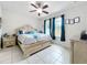 Serene main bedroom showcasing tile floors, a ceiling fan, and natural light at 14234 Desert Haven St # 14234, Windermere, FL 34786