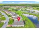 Aerial view of the home's location within a community, highlighted by nearby ponds and lush green spaces at 159 Olympus Way, Kissimmee, FL 34759