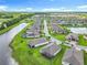 Aerial view of community featuring ponds, well manicured lawns, and water views at 159 Olympus Way, Kissimmee, FL 34759