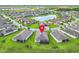 Aerial view showcases the property nestled in a lush community, surrounded by serene lakes and neatly arranged homes at 159 Olympus Way, Kissimmee, FL 34759