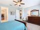 Bedroom featuring access to a walk-in closet and a view into the living room at 159 Olympus Way, Kissimmee, FL 34759