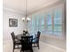 Bright dining area with natural light streaming through plantation shutters, creating a welcoming atmosphere at 159 Olympus Way, Kissimmee, FL 34759