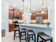 Modern kitchen with stainless steel appliances, granite countertops, and a stylish island with bar seating at 159 Olympus Way, Kissimmee, FL 34759
