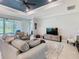 Comfortable living room featuring neutral paint, ample seating, ceiling fan, and natural light, perfect for relaxation at 159 Olympus Way, Kissimmee, FL 34759