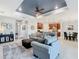 Spacious living room features a modern design that flows into the kitchen and dining area with recessed lighting at 159 Olympus Way, Kissimmee, FL 34759