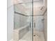 Modern tiled shower with a glass door and built-in bench at 159 Olympus Way, Kissimmee, FL 34759