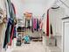 Bright walk-in closet featuring shelving, hanging storage, and shoe racks to maximize organization at 159 Olympus Way, Kissimmee, FL 34759
