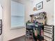 Functional workshop featuring ample storage, a work desk, and natural light at 159 Olympus Way, Kissimmee, FL 34759