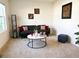 Bright living room with a comfortable sofa, decorative wall art, and contemporary accent furniture at 1591 Barberry Dr, Kissimmee, FL 34744