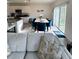 Sunlit living space with open floor plan, seamlessly connecting the kitchen and dining area at 1591 Barberry Dr, Kissimmee, FL 34744