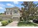 Charming townhome with a brick driveway, attached garage, and well-manicured landscaping for a welcoming curb appeal at 196 Canterbury Bell Dr, Oviedo, FL 32765